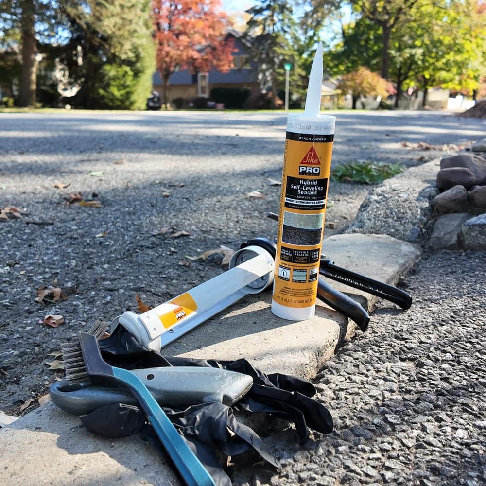 Sika 10.1 fl. oz. Hybrid Self-Leveling Concrete and Asphalt Sealant Black (3)
