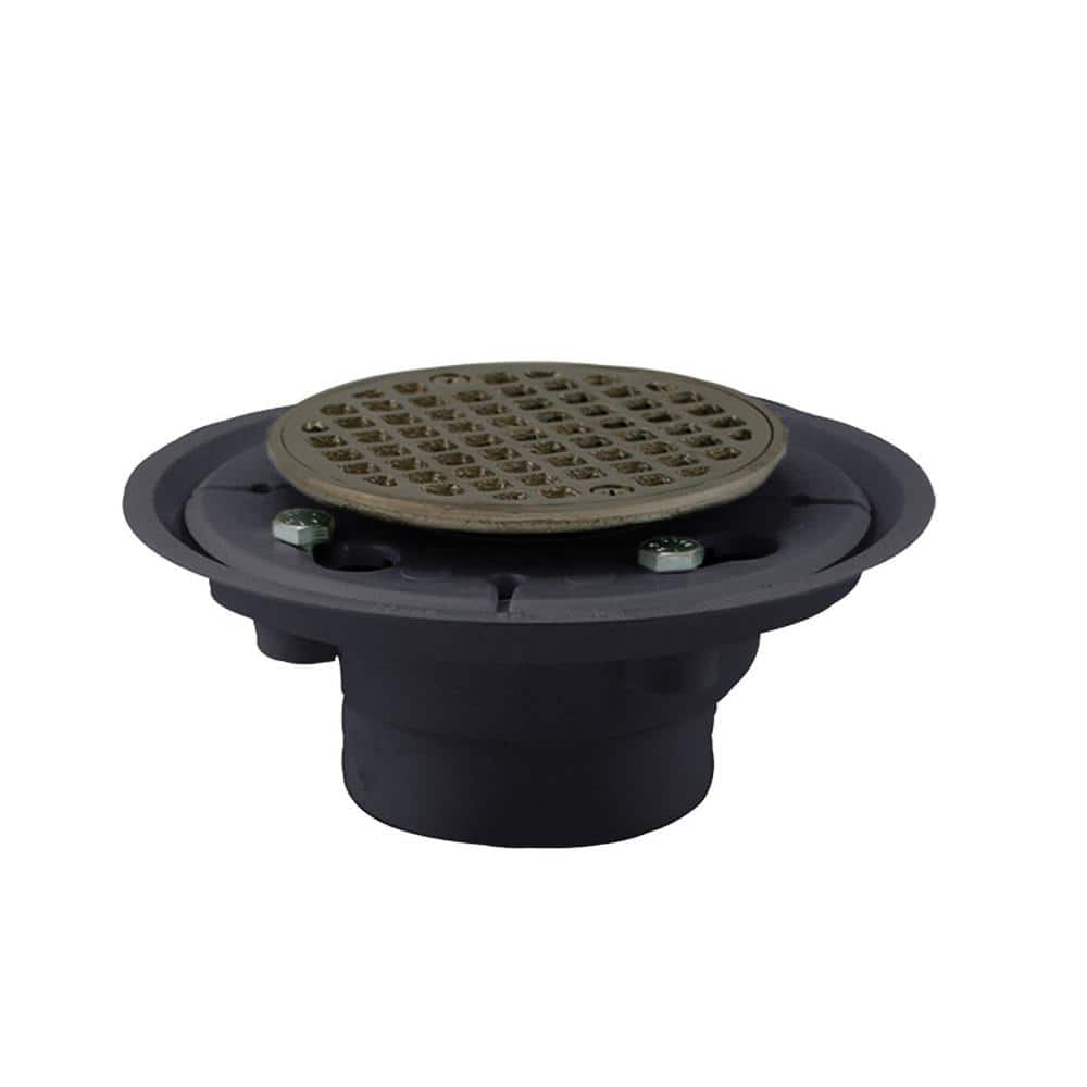 JONES STEPHENS 2 in. 3 in. PVC Shower/Floor Drain with Brass Tailpiece and 4 in. Round Strainer