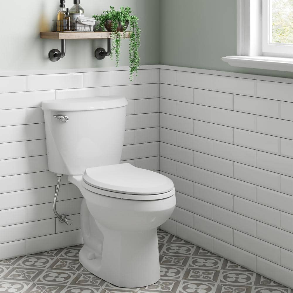 American Standard Reliant Two-Piece 1.28 GPF Single Flush Elongated Standard Height Toilet with Slow-Close Seat in White (2)